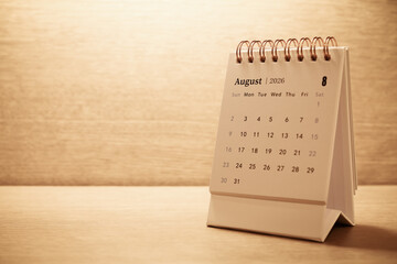 Calendar page of August 2026 on desk, with copy space. monthly planning concept, important schedules, meetings, and appointments.