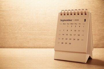 Calendar page of September 2026 on desk, with copy space. monthly planning concept, important schedules, meetings, and appointments.