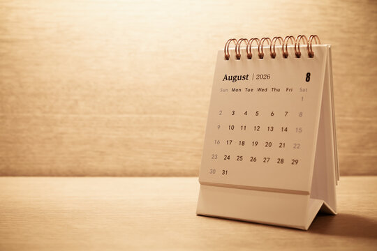Calendar page of August 2026 on desk, with copy space. monthly planning concept, important schedules, meetings, and appointments.