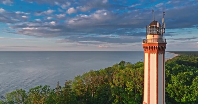 Beautiful lighthouse at sunset in Rewal at Baltic Sea.