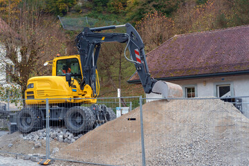 Yellow excavator on construction site. excavator loader machine during parked outdoors at construction site