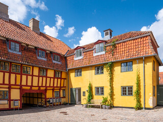 Andresens Købmandsgård merchant’s yard with timber-framed yellow buildings, Kerteminde, Funen, Southern Denmark © TasfotoNL