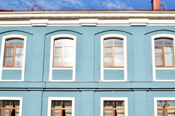 Part of a building with blue windows in Scandinavian style