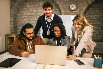 Diverse business team watching presentation on laptop