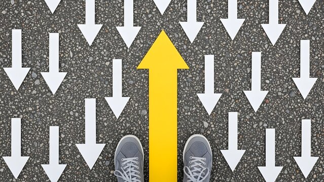 A person standing at a crossroads with a crowd following opposite directions