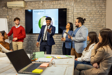 Multiracial business team attending presentation in conference room