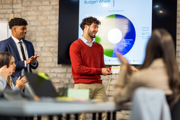 Business team receiving annual awards in office