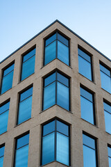 Modern office building in scandinavia with blue skies in the background.