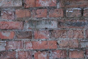 A brick wall with a hole in it