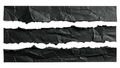 Torn black paper strips with crumpled texture and jagged edges against a dark background