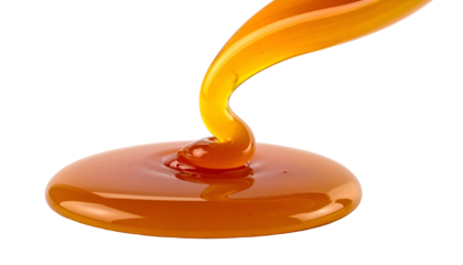 Smooth, flowing, glossy caramel pours and pools against a stark black background