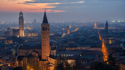Verona old town skyline at blue hour with illuminated streets © Grigore