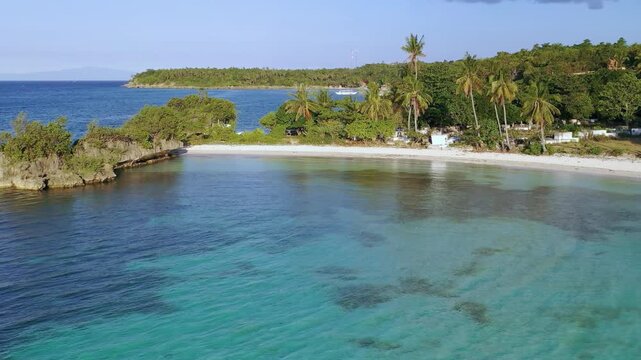 Aerial view of shallow lagoon and sandy tropical shoreline