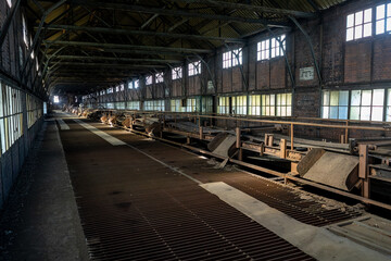 Long abandoned factory interior with machinery