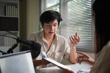Close-up of a podcast conversation showing collaboration, planning, and communication in a modern home studio