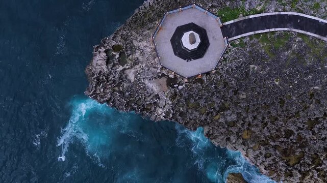 Aerial View Stormwatch Octagonal Deck On Rugged Headland With Pounding Surf, Cinematic Monitoring Scene Evokes,Nusa Dua,Bali