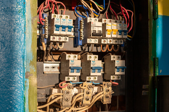 Close-up view of circuit breakers with fuse box or circuit breaker in an old industrial building.