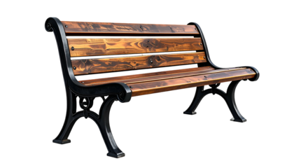 Classic park bench with wooden slats and ornate black metal supports, isolated on black