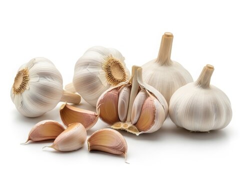 Fresh garlic bulbs and cloves with natural texture, isolated on white background.
