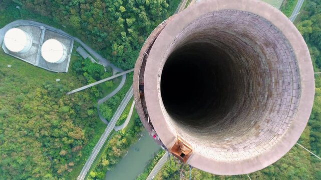 Top-down aerial view into industrial chimney opening in Trbovlje