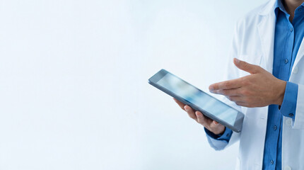 Doctor uses tablet for patient data. Closeup clinician in lab coat taps tablet screen, explaining digital chart on tablet for telemedicine, for world health day, doctors day ads, clean copy space