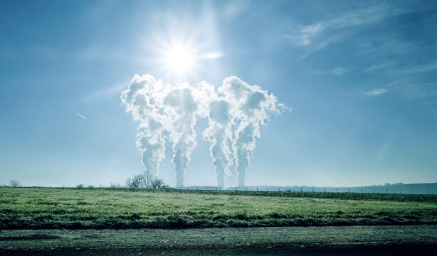 centrale nucl&eacute;aire , et ses fum&eacute;es blanches dans un paysage champ&ecirc;tre  , &eacute;nergie nucl&eacute;aire , &eacute;lectricit&eacute; , soleil dans un ciel bleu , 