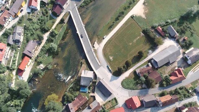 Aerial view of bridge and town along the Krka River in Žužemberk
