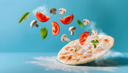 Levitating Pizza Crust With Flying Tomatoes Mushrooms And Basil On Blue Background