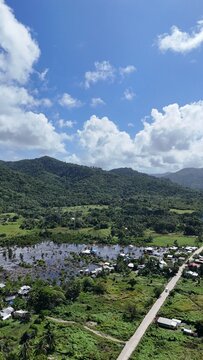 Hills in El Nido north with a Djungle full of animals and blue skies. The Main Road to El Nido from Nacpan Beach