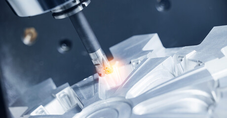 Cnc milling machine in operation crafting intricate metal designs © Parilov