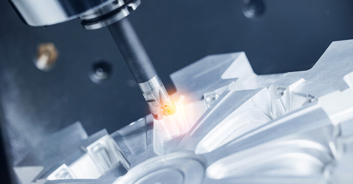 Cnc milling machine in operation crafting intricate metal designs