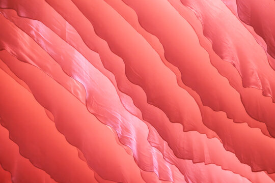 8K red wavy pattern abstract background. Generic background for all purposes. Vibrant colours cinematic style.