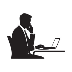 A silhouette of a businessman thoughtfully working on a laptop at a desk