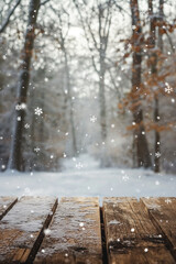 Empty wooden table in snowy forest with falling snow. Winter background concept.