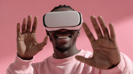Smiling man in VR headset with hands raised. Virtual reality fun concept.