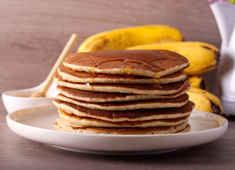 Overripe banana pancakes stacked on plate