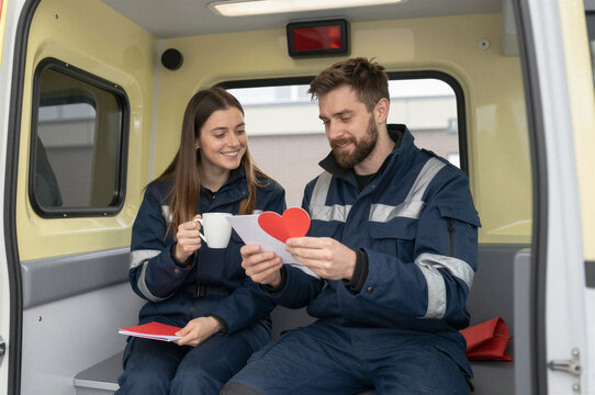 A female health care worker receives a valentine gift at work. Doctor celebrating Valentines day in hospital