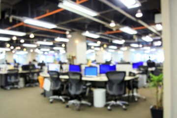 Fototapeta premium Beautiful blurred background of a light modern office interior, ffice space in an unfocused view. Modern blurred background photo for banner, poster or magazine and website background. High quality.