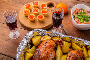 Red caviar tartlets on a plate and a heart-shaped salad. Baked chicken breast