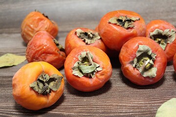 persimmons, orange sharons, autumn fruits, persimmons in a wooden box, ripe fruits