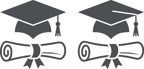 Four black graduation caps and diplomas in clean