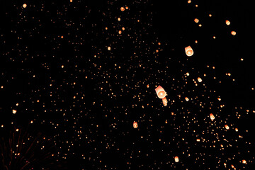 Iconic Yi Peng sky lantern festival. A stunning visual of Thailand's heritage.