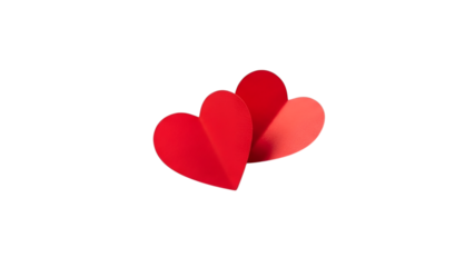Two vibrant red paper hearts symbolizing love against a stark black background