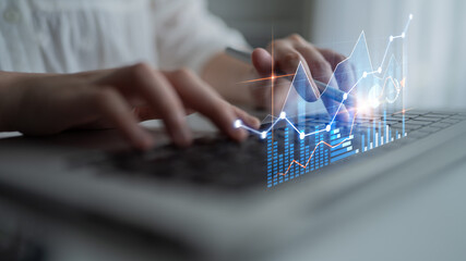 A close-up image capturing hands typing on a laptop keyboard with an overlay of graphs and growth indicators, symbolizing data analysis and business success. Scalp