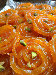 Traditional Jalebi Sweets Garnished with Pistachio Close-Up