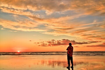 Foxton Beach New Zealand Sunset High Tide A Man Watching The Sun Go Down