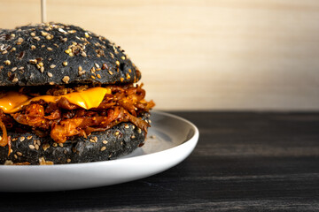 Vegan pulled mushroom burger on dark background