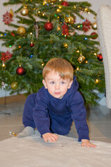 Toddler Crawling Before Christmas Tree