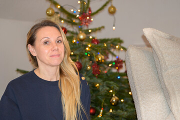 Woman Standing Near Christmas Tree