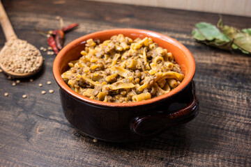 Pasta and lentils served on a ceramic bowl. Mediterranean food naturally vegan.